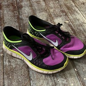Purple Nike running shoes
